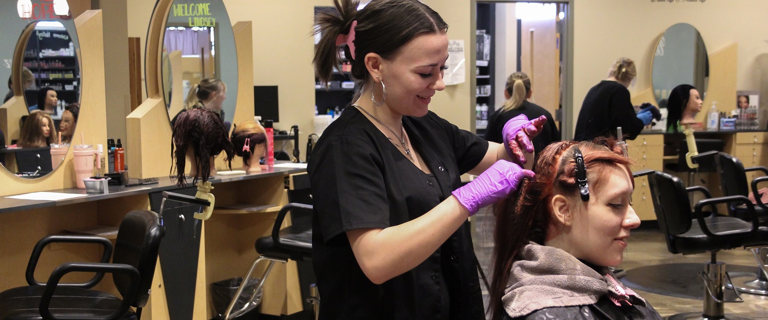 Cosmetology instructor with students