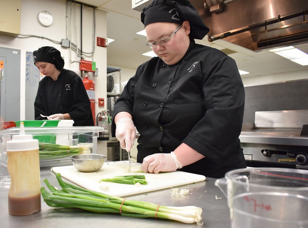 Students prepare lunch in culinary arts lab