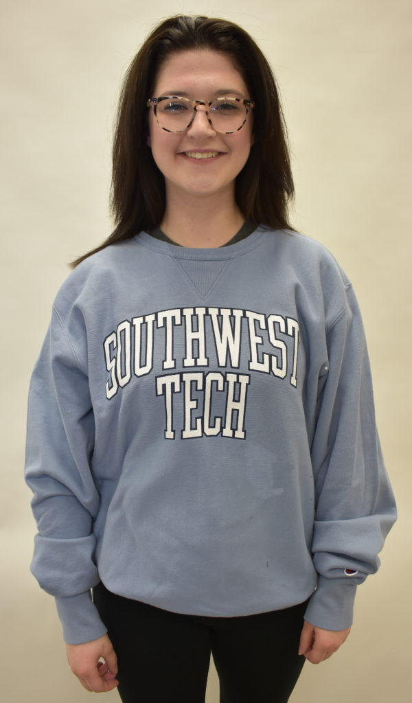 Female in blue Southwest Tech sweatshirt. 