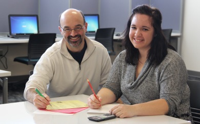 Math instructor assisting a student John Pluemer